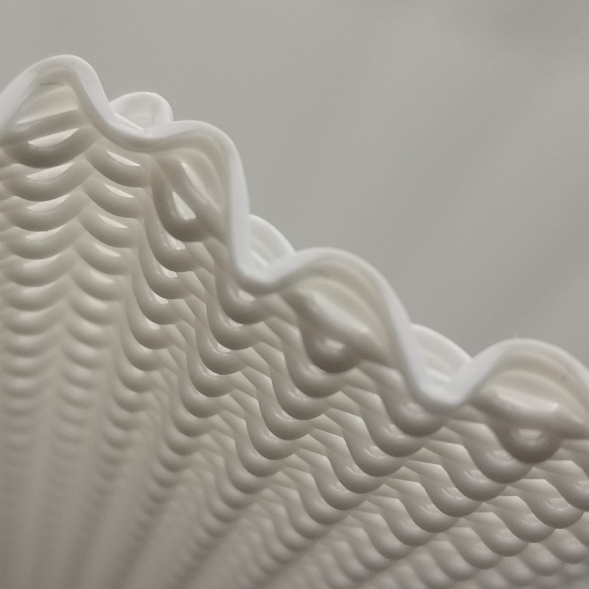 Close-up of a textured white surface with wavy patterns