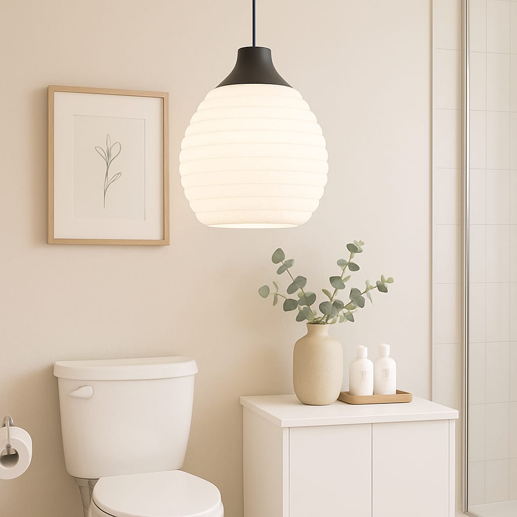 Bathroom interior with a pendant light, toilet, and decorative elements.