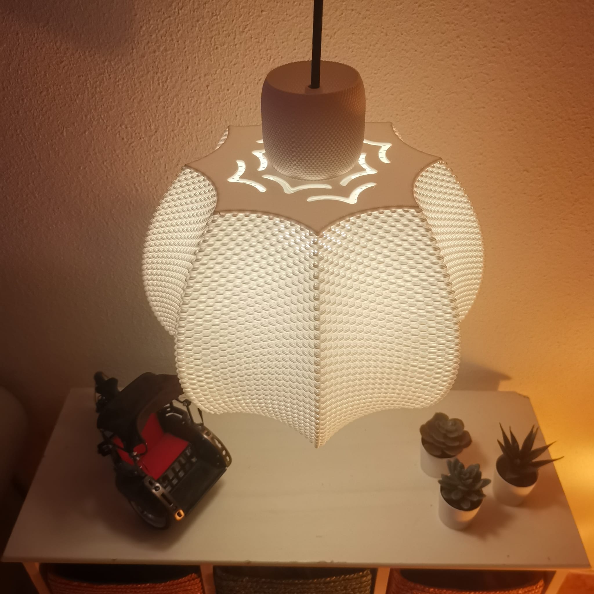 Modern pendant light on a table with decorative items