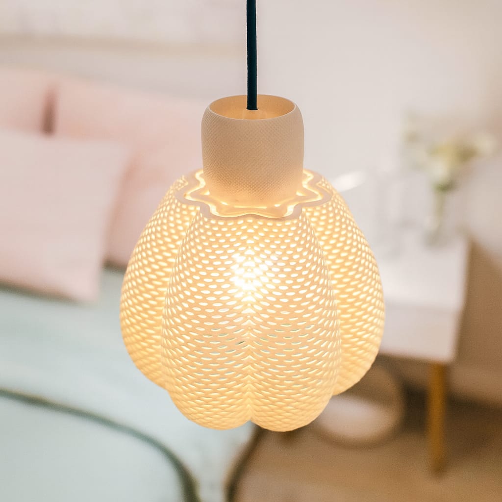 Decorative pendant light with textured design in a softly blurred room setting