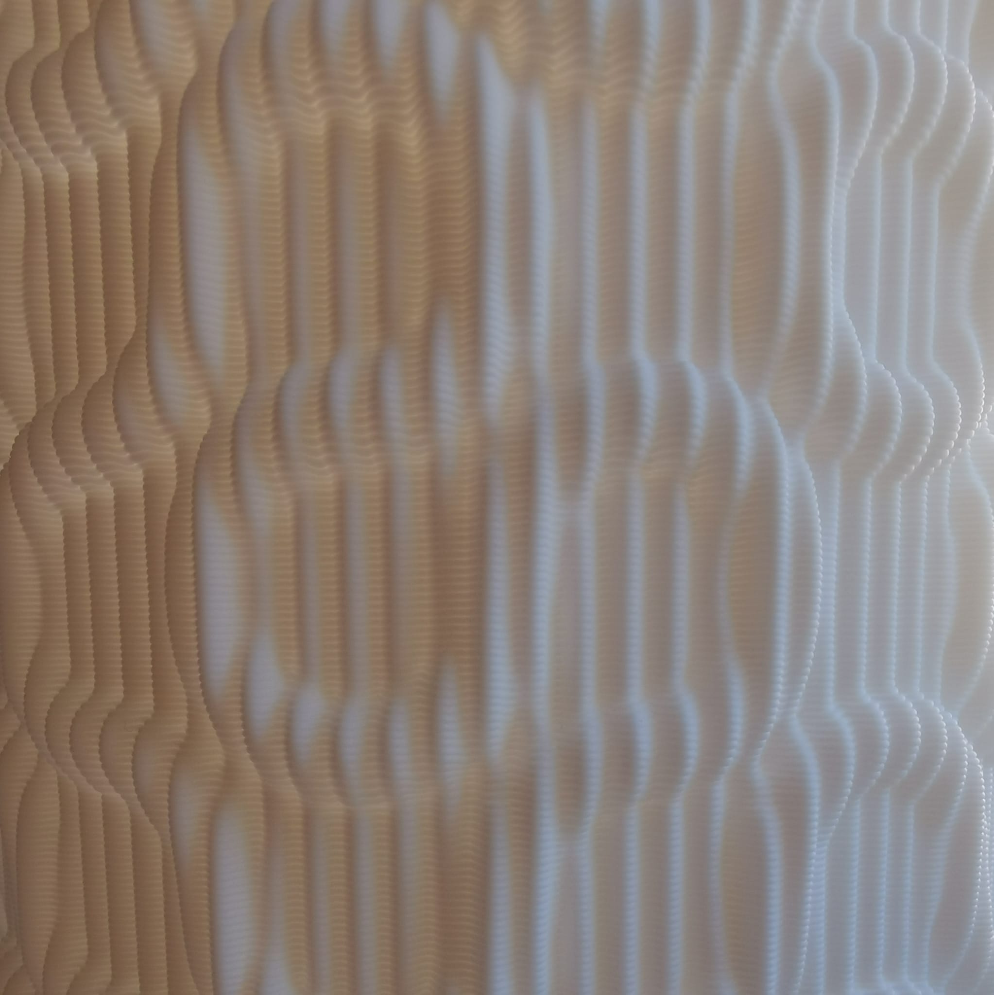 Textured beige surface with wavy patterns