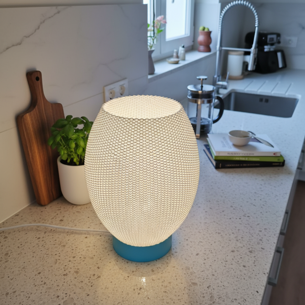 Decorative table lamp on a kitchen counter with a modern interior setting.