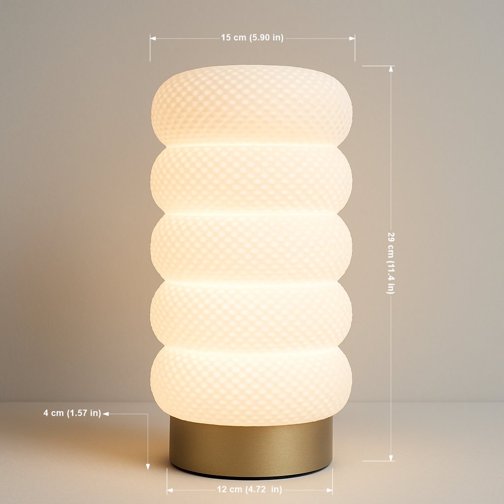 Decorative table lamp with textured design and gold base, shown with measurements on a neutral background.