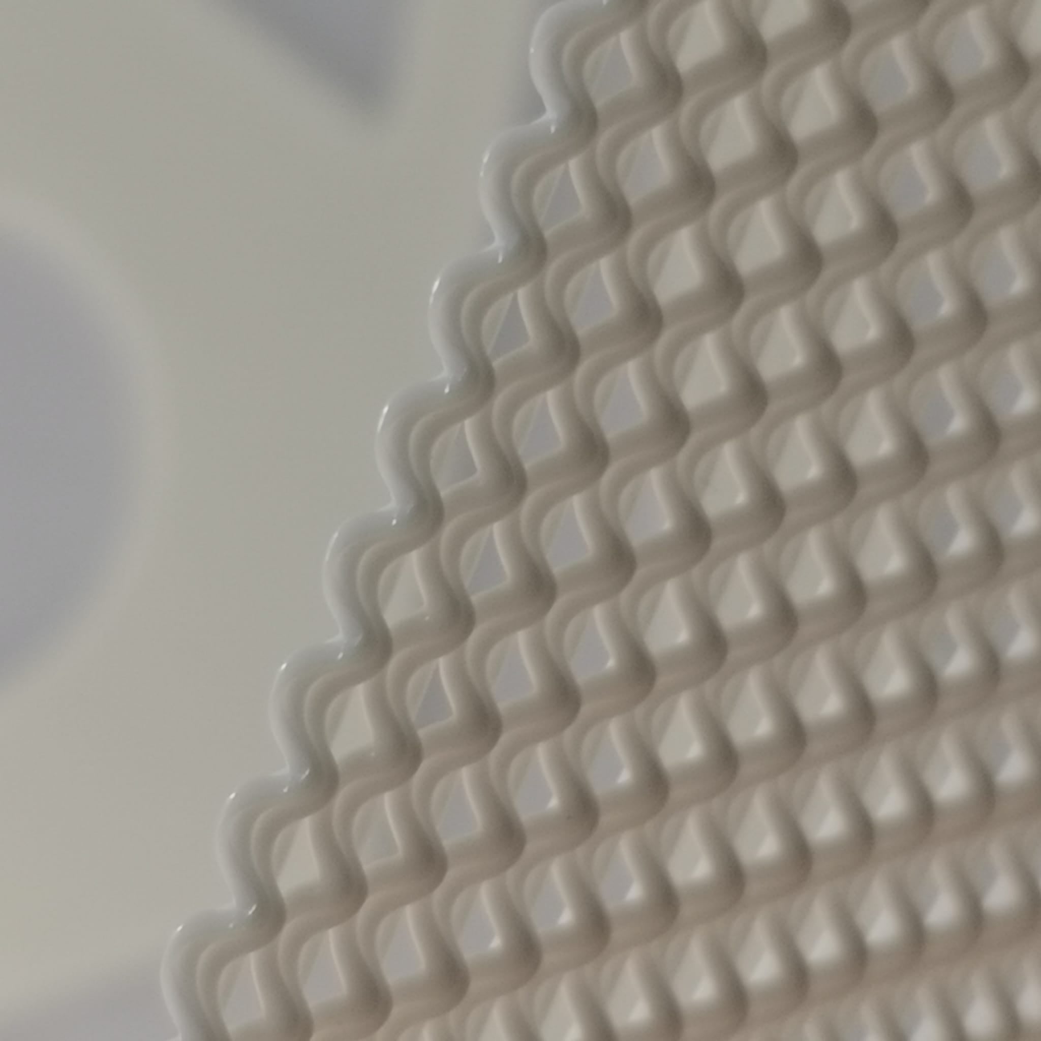 Close-up of a textured beige surface with wavy pattern