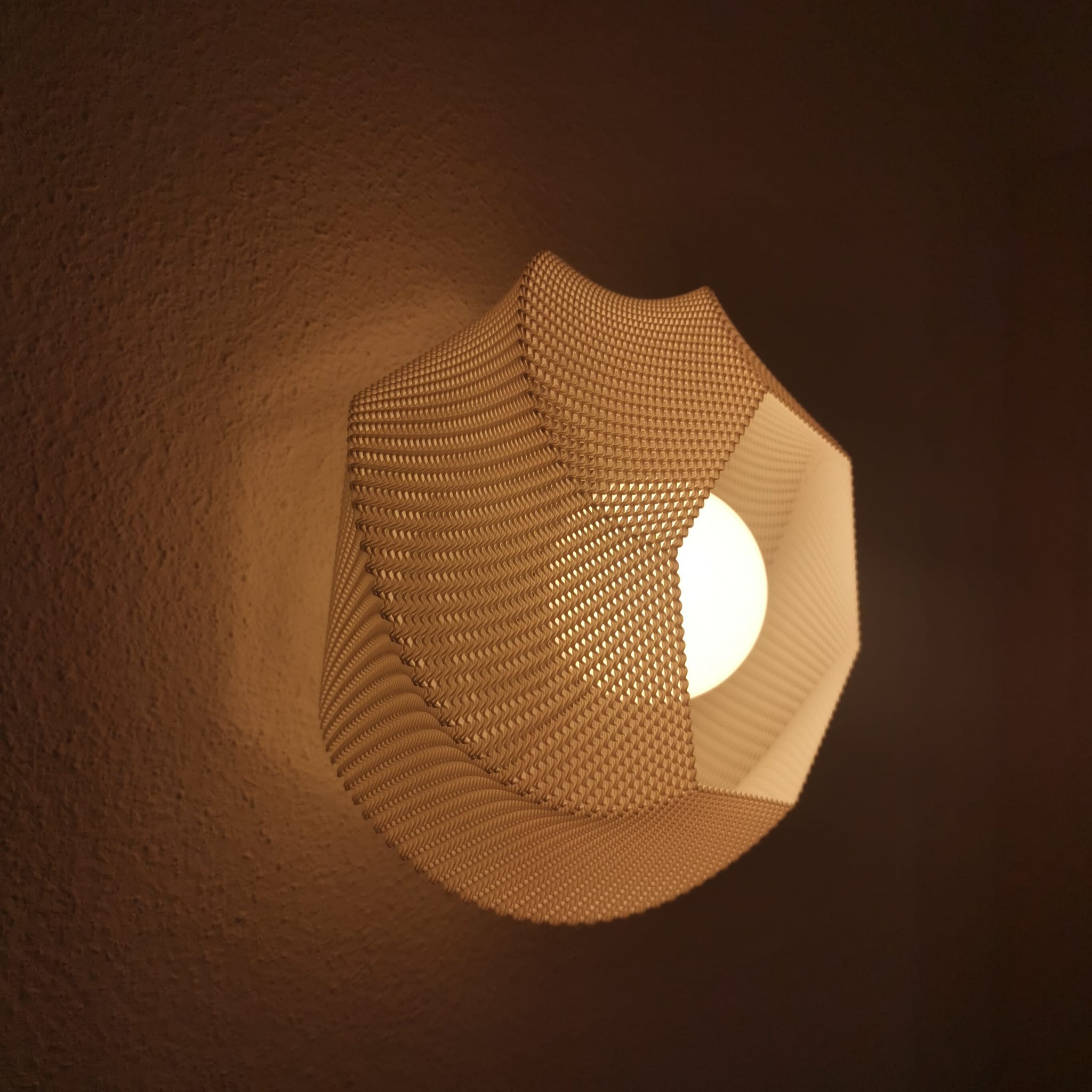 Geometric wall light fixture on a dark background