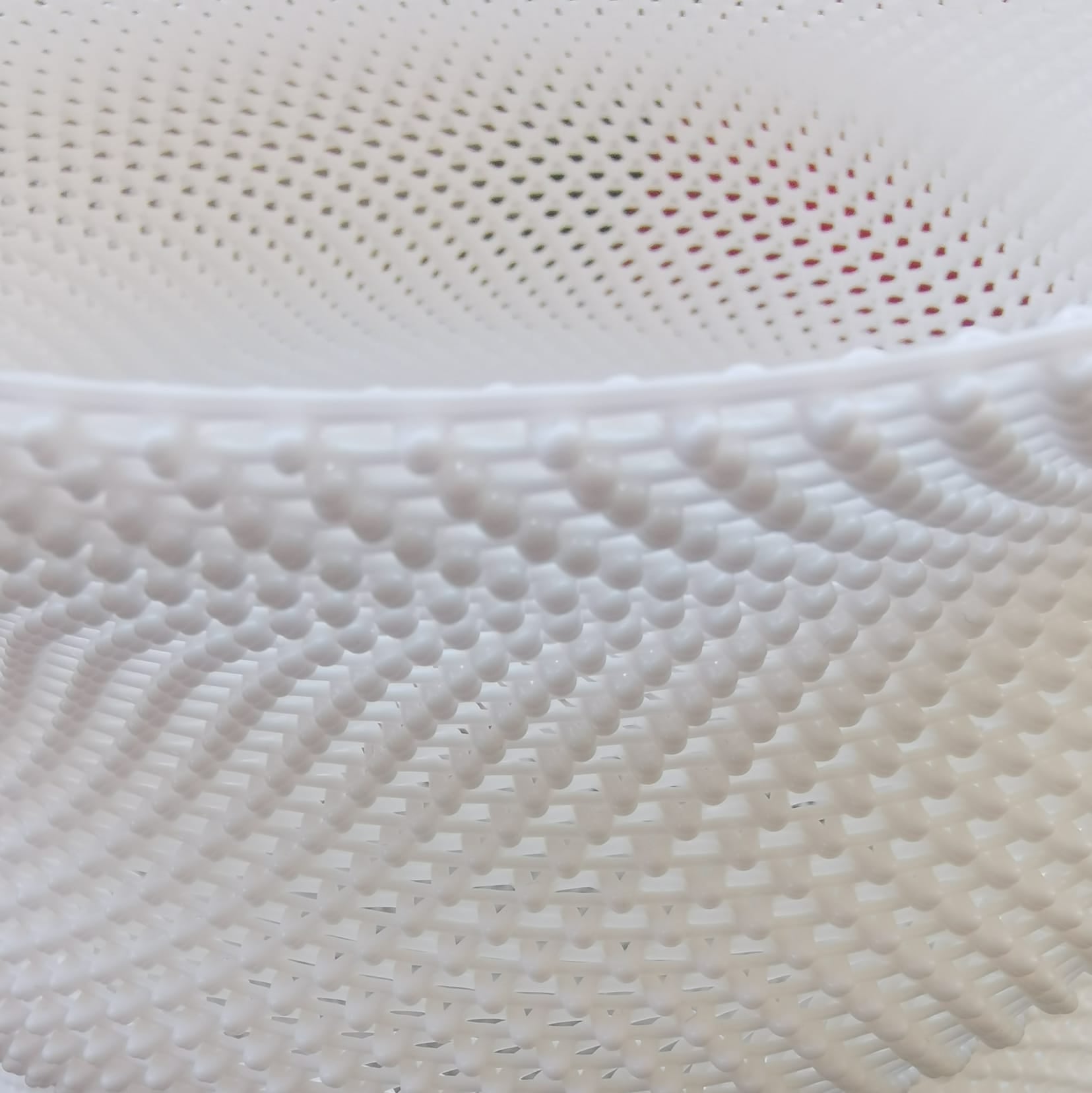 Close-up of textured white fabric with a subtle pattern