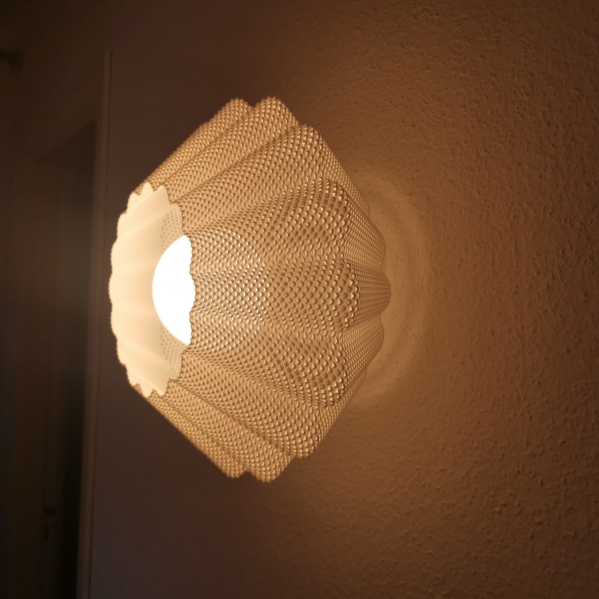 Decorative wall light fixture on a brown wall
