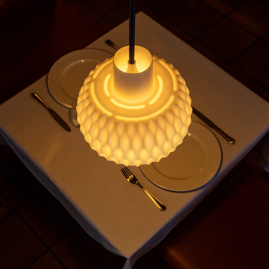 Decorative lamp on a table with plates and cutlery
