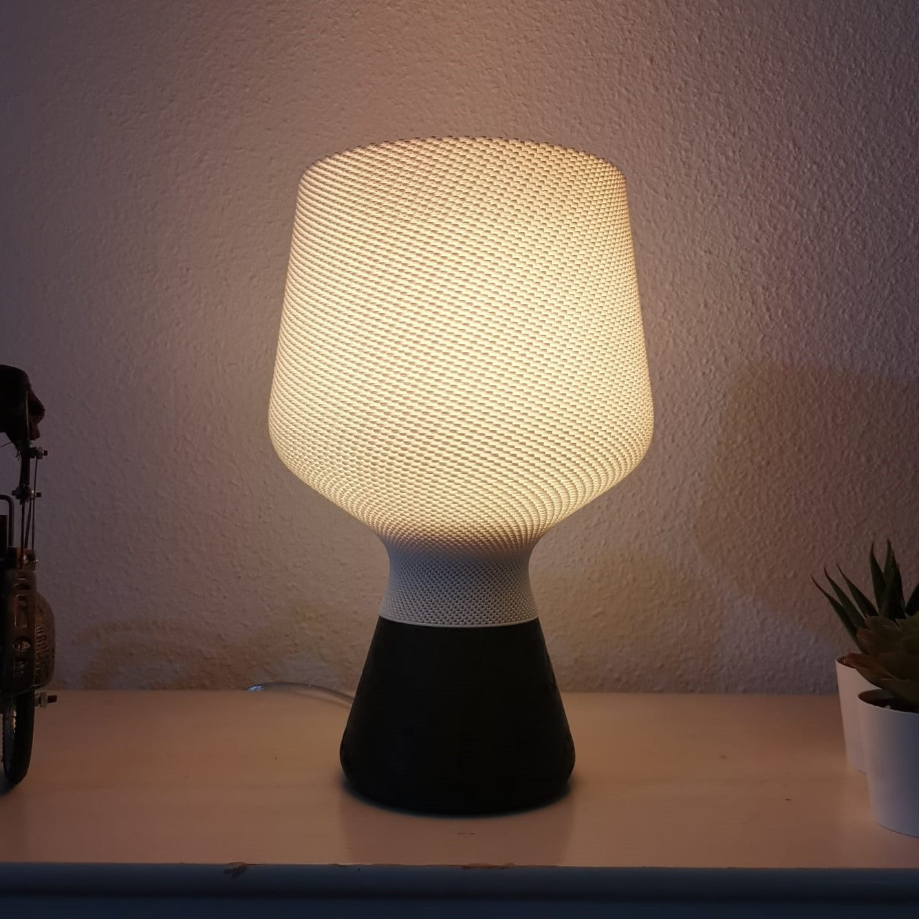 Textured table lamp on a surface with a neutral background