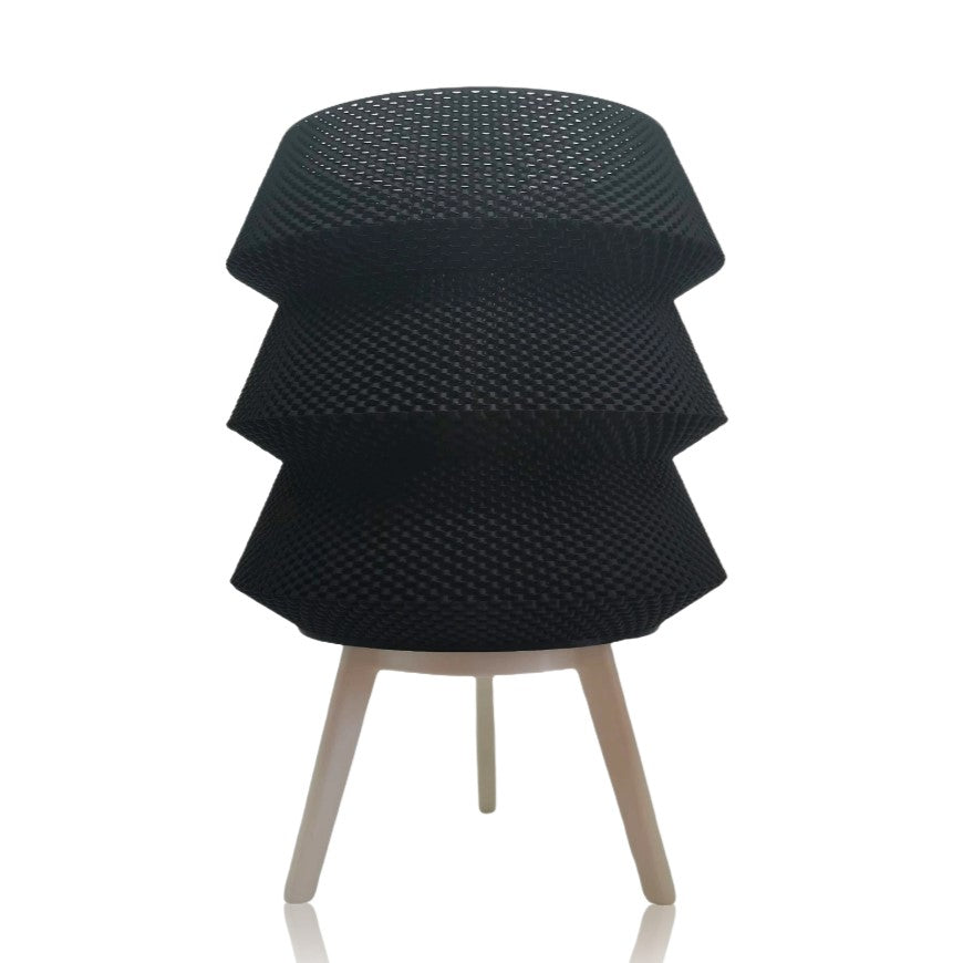 Black textured table lamp with legs on a white background
