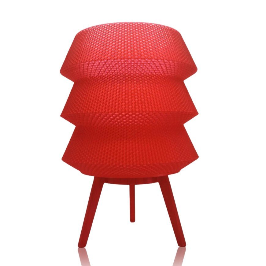Red textured table lamp on a white background