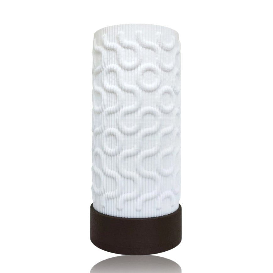 White textured cylindrical table lamp with a brown base on a white background