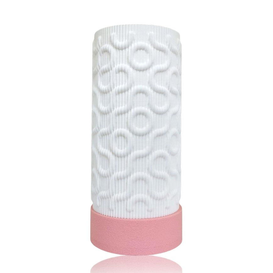 White textured table lamp with pink base on a white background