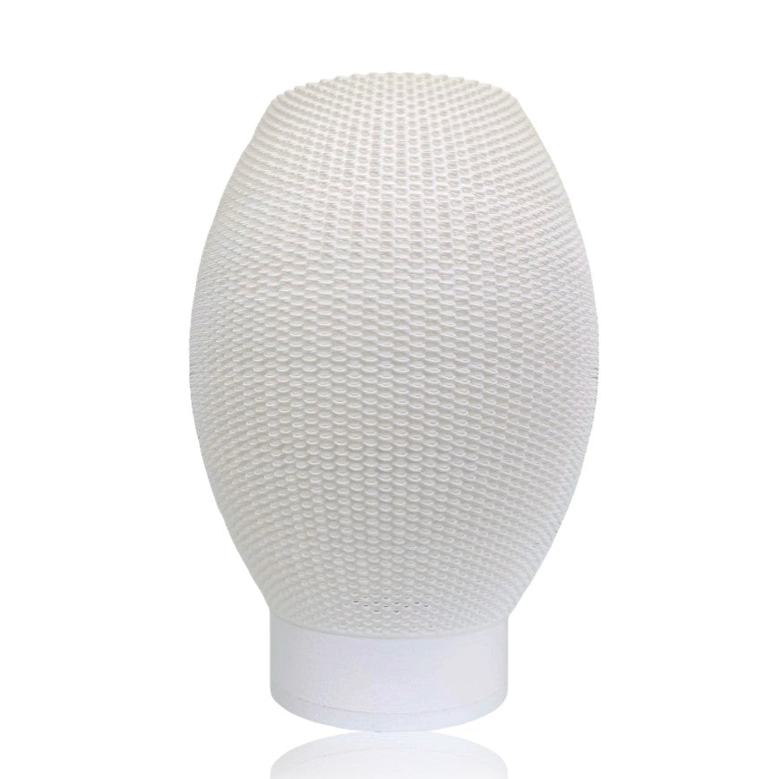 Textured white table lamp on a white background