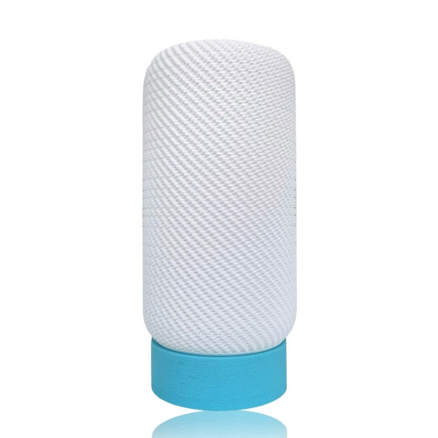 Textured white cylindrical table lamp with a blue base on a white background