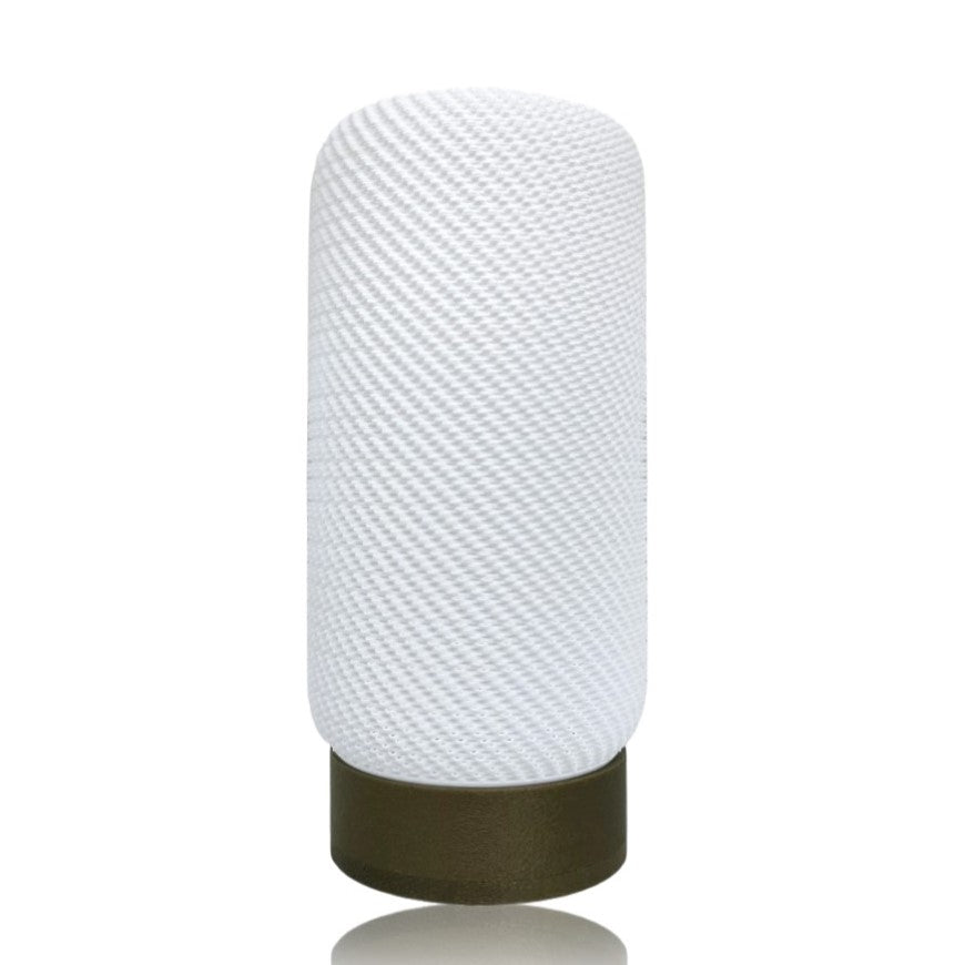 White textured lamp with gold base on a white background