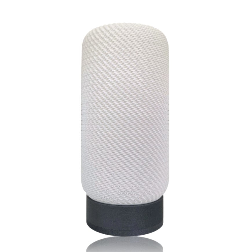 Textured white lampshade with silver base on a white background