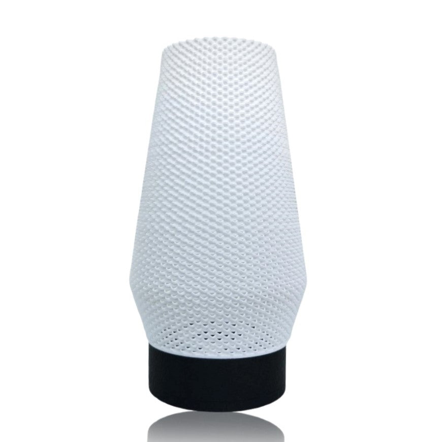 White textured table lamp with black base on a white background