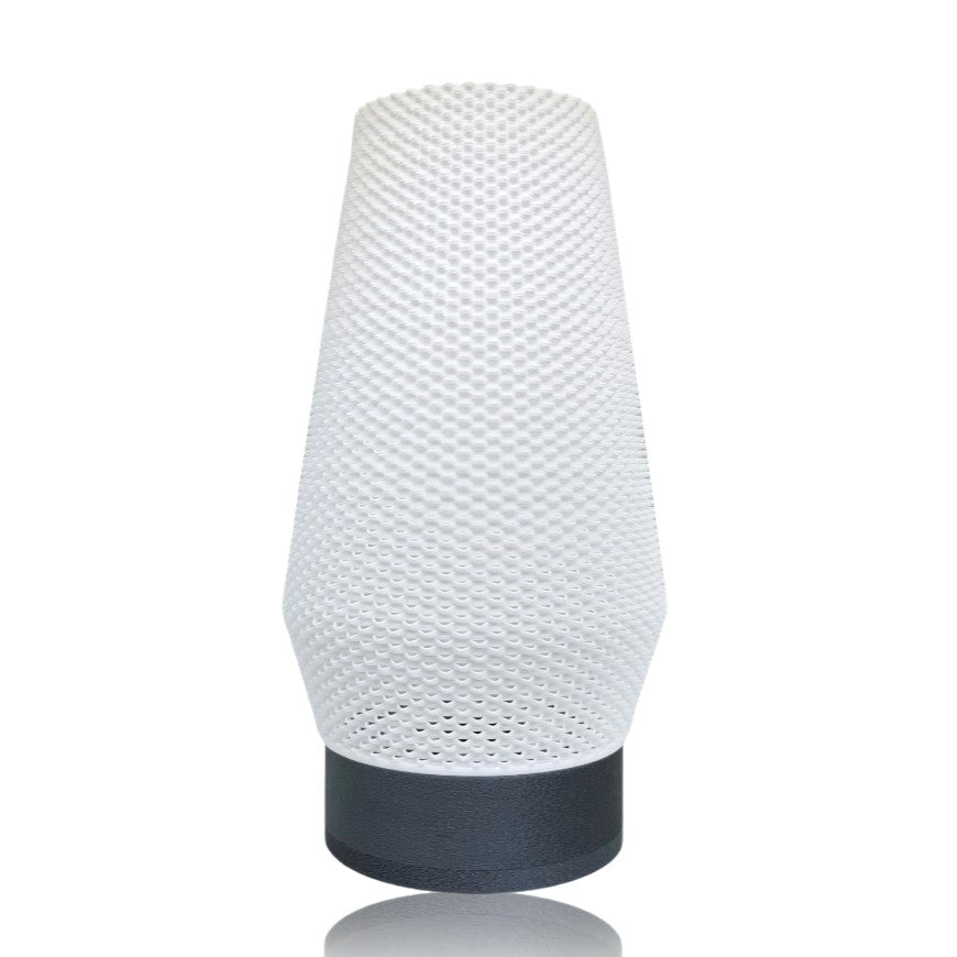 White textured lamp with silver base on a white background