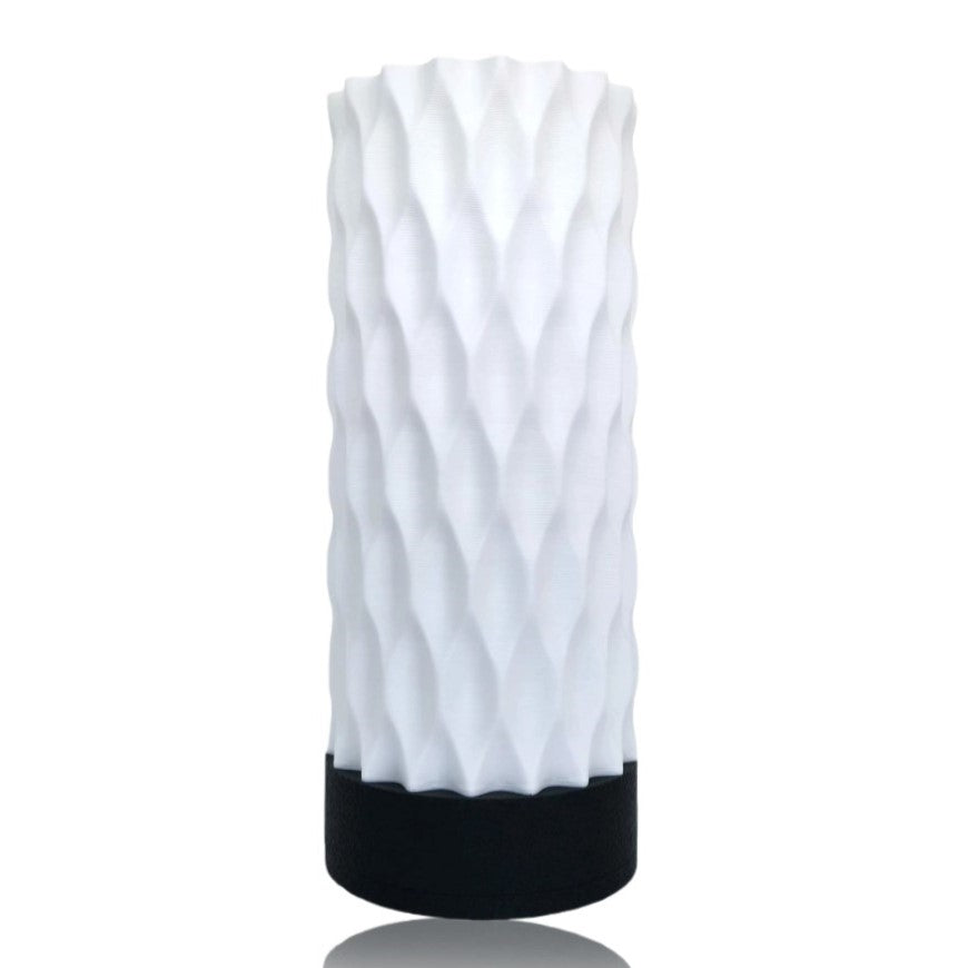 White textured table lamp with black base on a white background