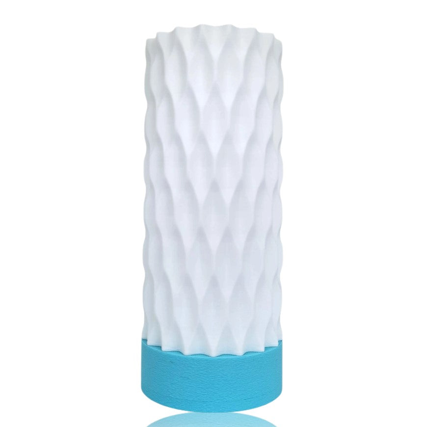 White textured table lamp with a blue base on a white background