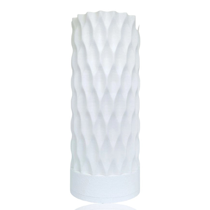 White table lamp with a textured pattern on a white background