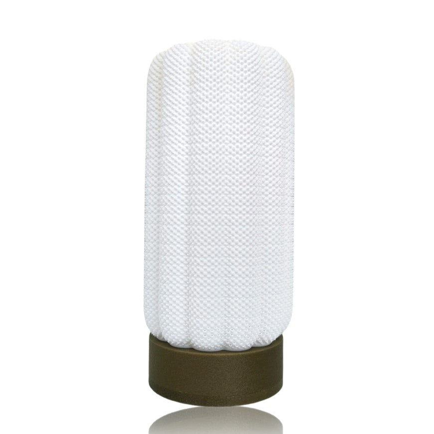Textured white lamp with gold base on a white background