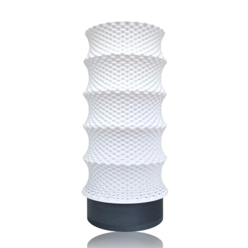 White textured cylindrical table lamp on a white background