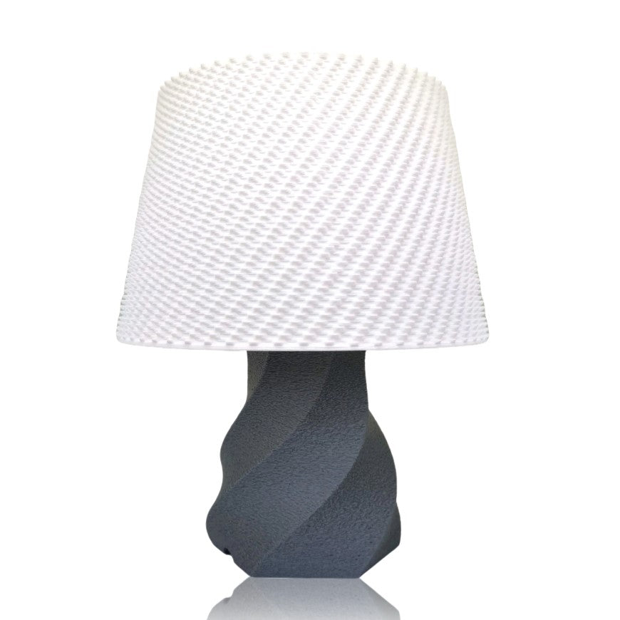 Table lamp with a textured white shade and dark base on a white background