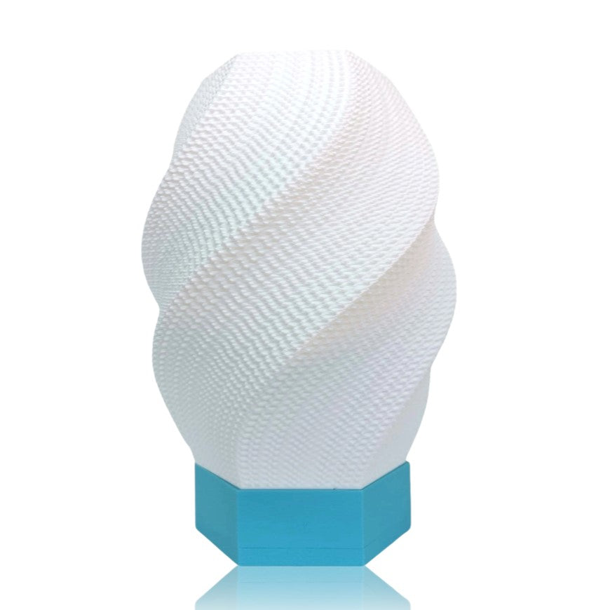 White textured table lamp with a blue base on a white background