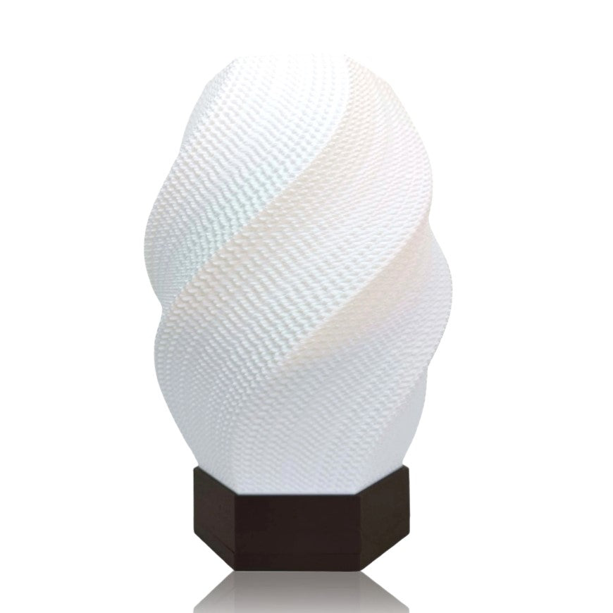 Decorative white lamp with textured design on a white background