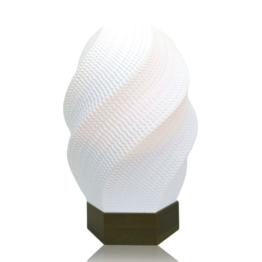 Decorative lamp with textured white shade and gold base on a white background
