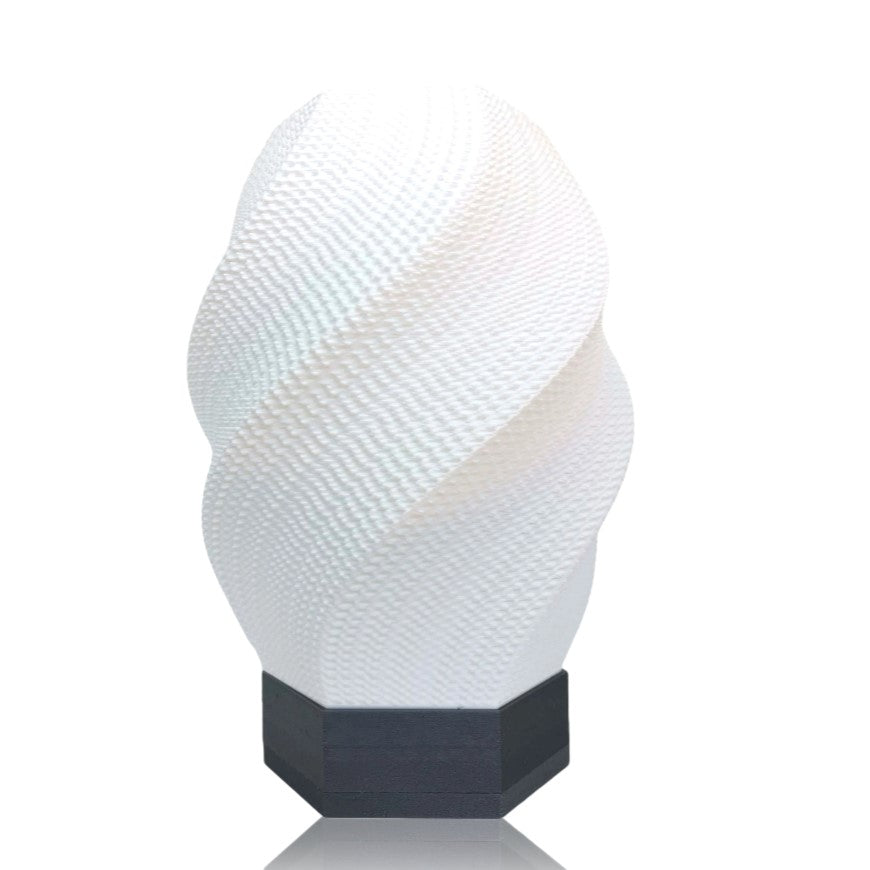 Textured white lamp with a silver base on a white background