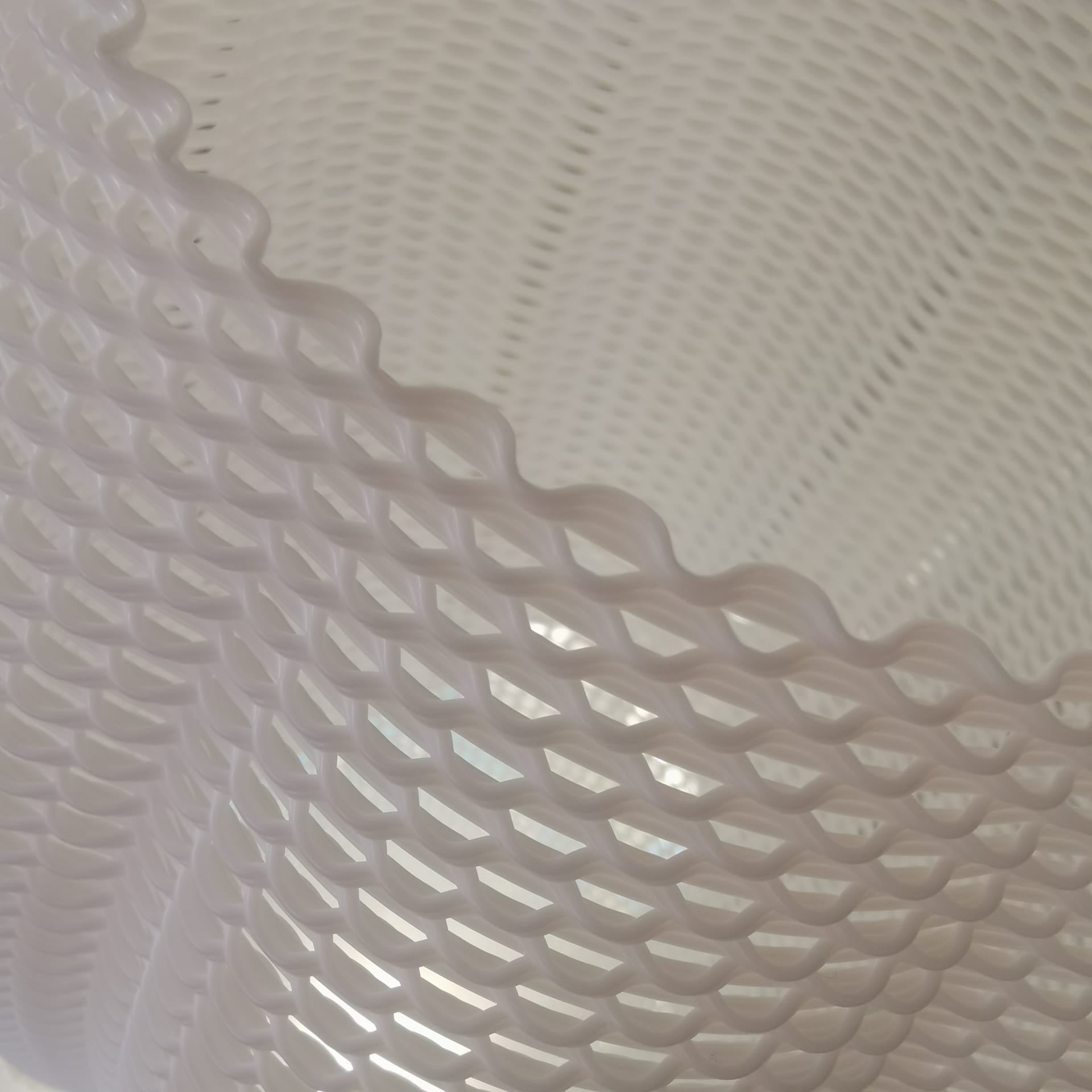 Close-up of a textured white surface with a wavy pattern