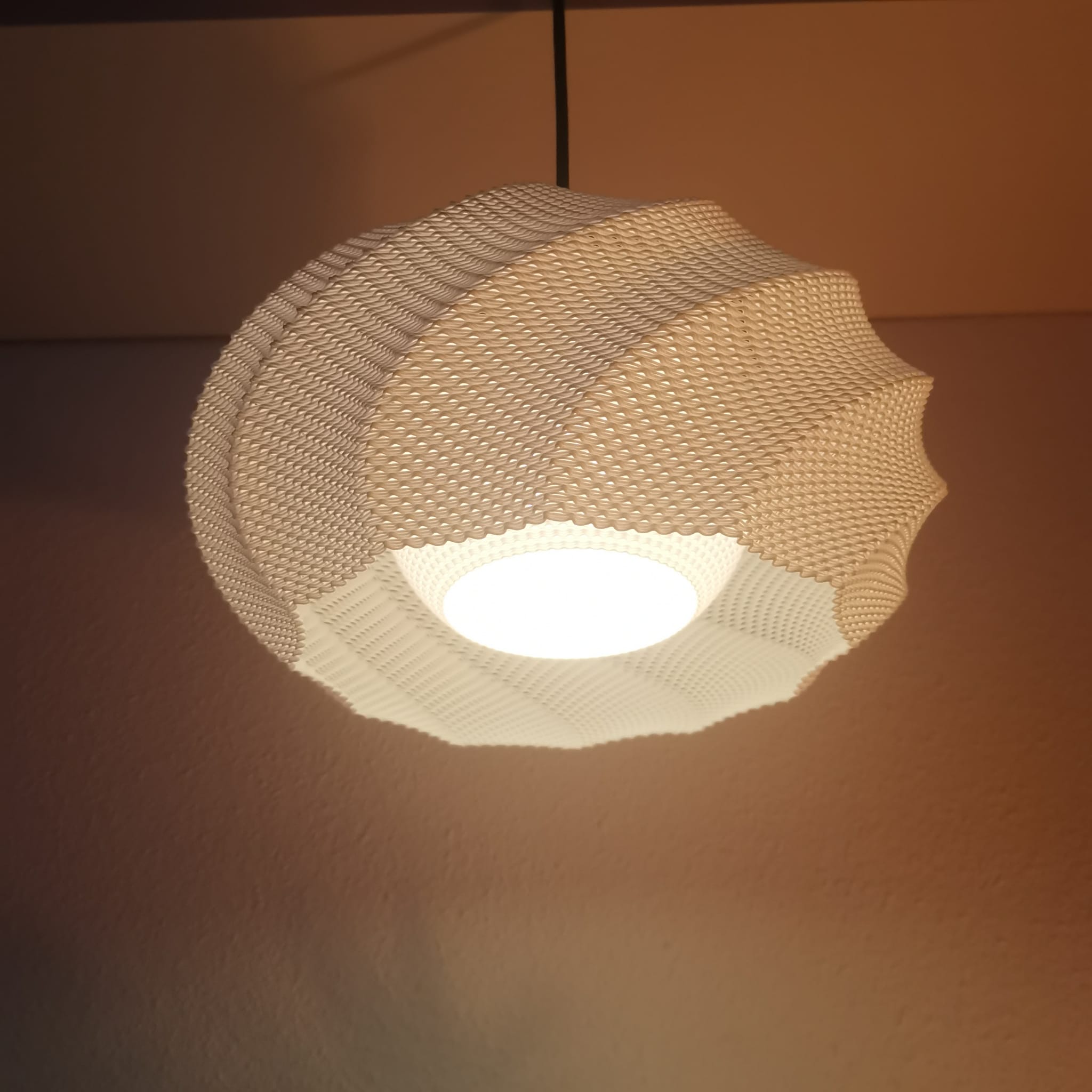 Woven light fixture on a brown background