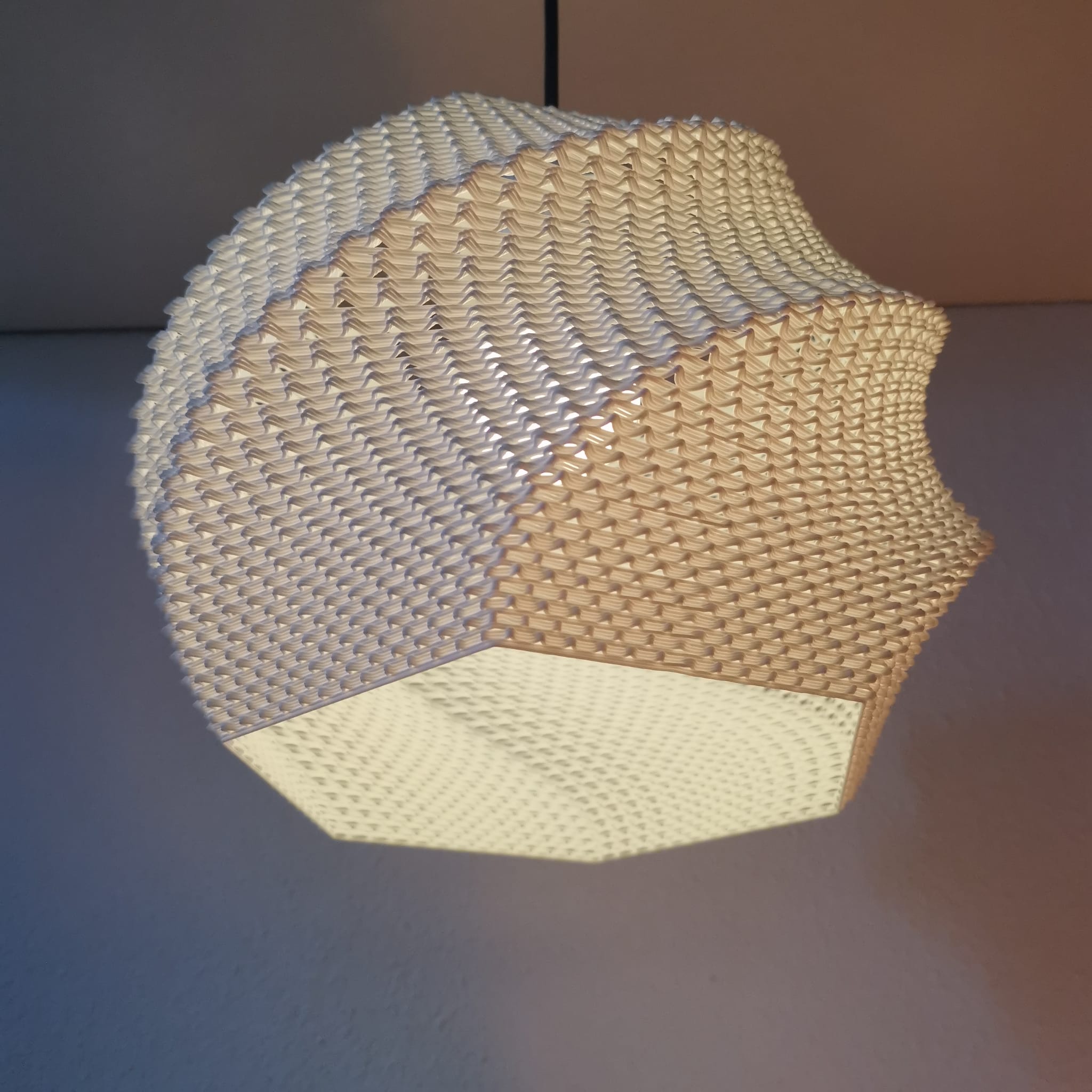 Woven lampshade with geometric pattern on a plain background