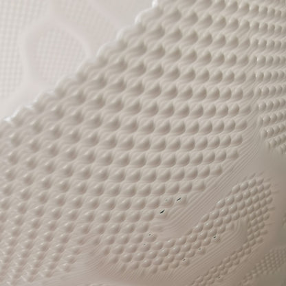 Close-up of the 3D-printed surface of a LampDesign piece, showcasing its refined layered texture and soft matte finish. Each lamp is printed with precision and hand-finished to create a warm, sculptural presence in any interior.