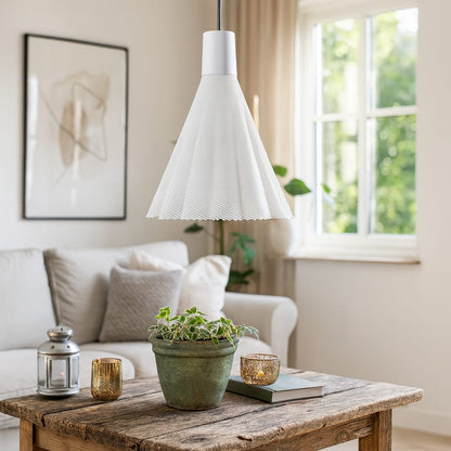 Living room with a wooden coffee table, potted plant, and white pendant light.