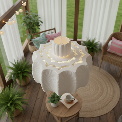 3D-printed pendant lamp with perforated details, shown from above in a cozy sunroom filled with plants and rattan furniture.