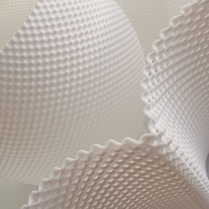 Close-up of textured white paper sheets