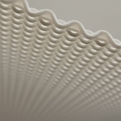 Close-up of textured white pendant lamp with wavy edge
