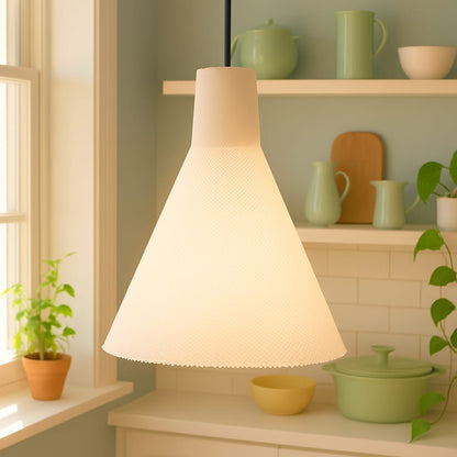 White pendant lamp on a kitchen counter with green kitchenware in the background