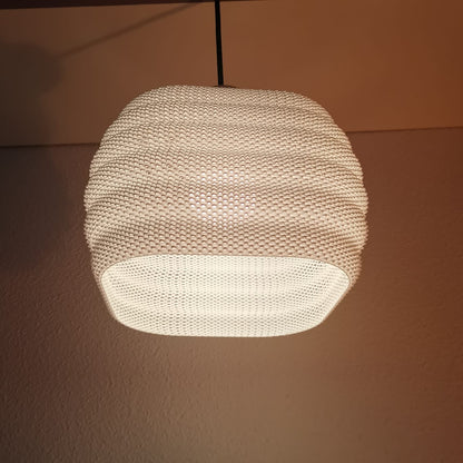 Textured pendant light fixture on a plain wall