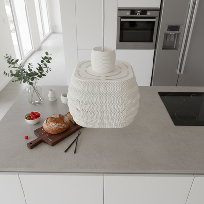 White textured pendant light hanging above a kitchen counter with bread and minimalist decor.