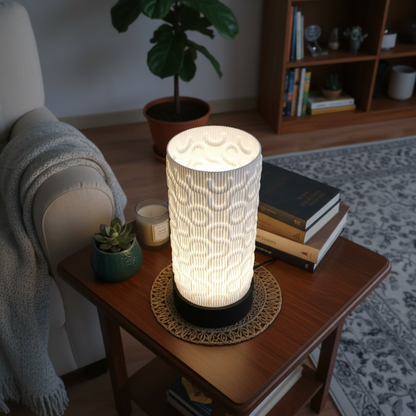 Decorative table lamp on a wooden side table in a cozy living room setting.