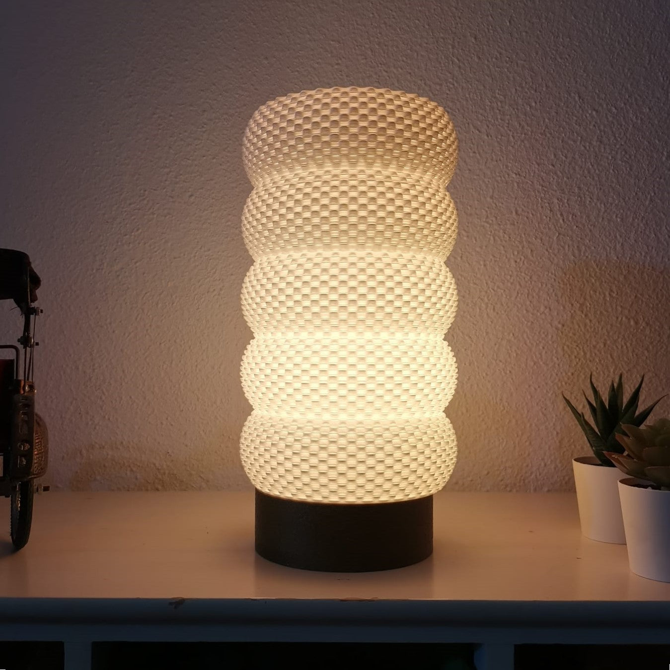 Textured table lamp on a surface with a neutral background