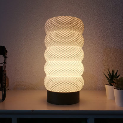 Textured table lamp on a surface with a neutral background