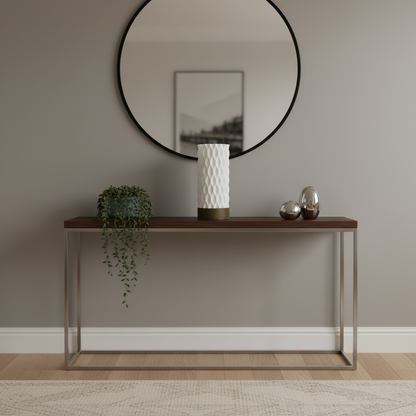 Console table with a table lamp against a plain wall