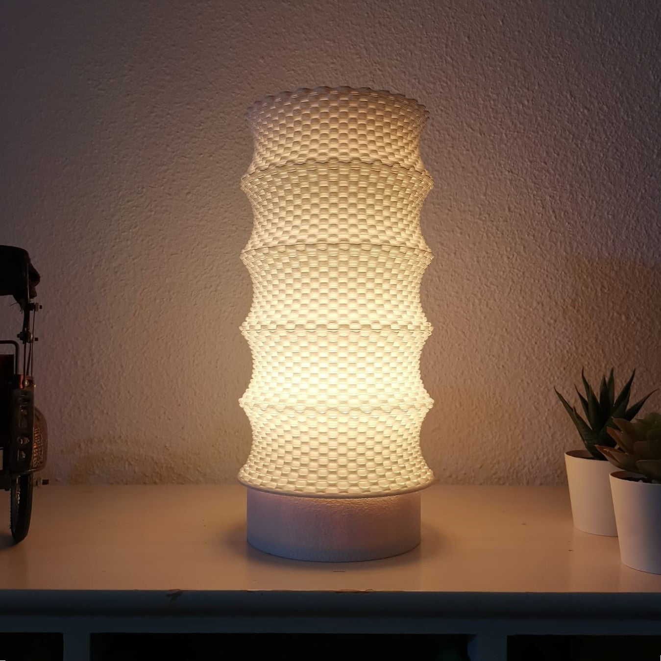 Textured table lamp on a surface with a neutral background
