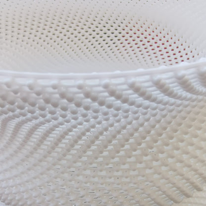 Close-up of textured white fabric with a subtle pattern